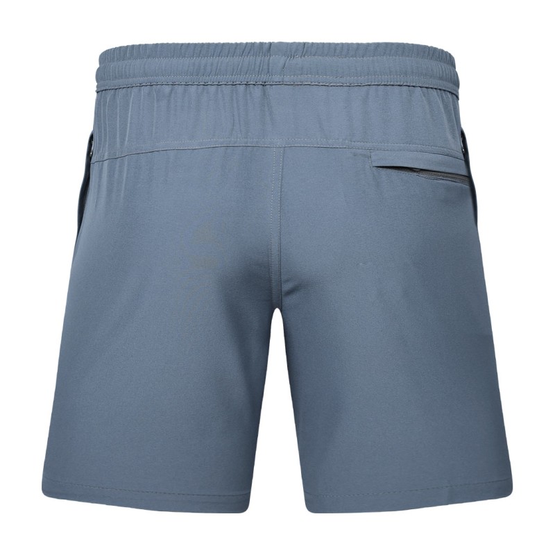 Detail shot of a man wearing comfortable grey-blue KTM CTY Aerfofit half pants, shorts, featuring a secure zip pocket and small side slits at the hem for ease of movement 3