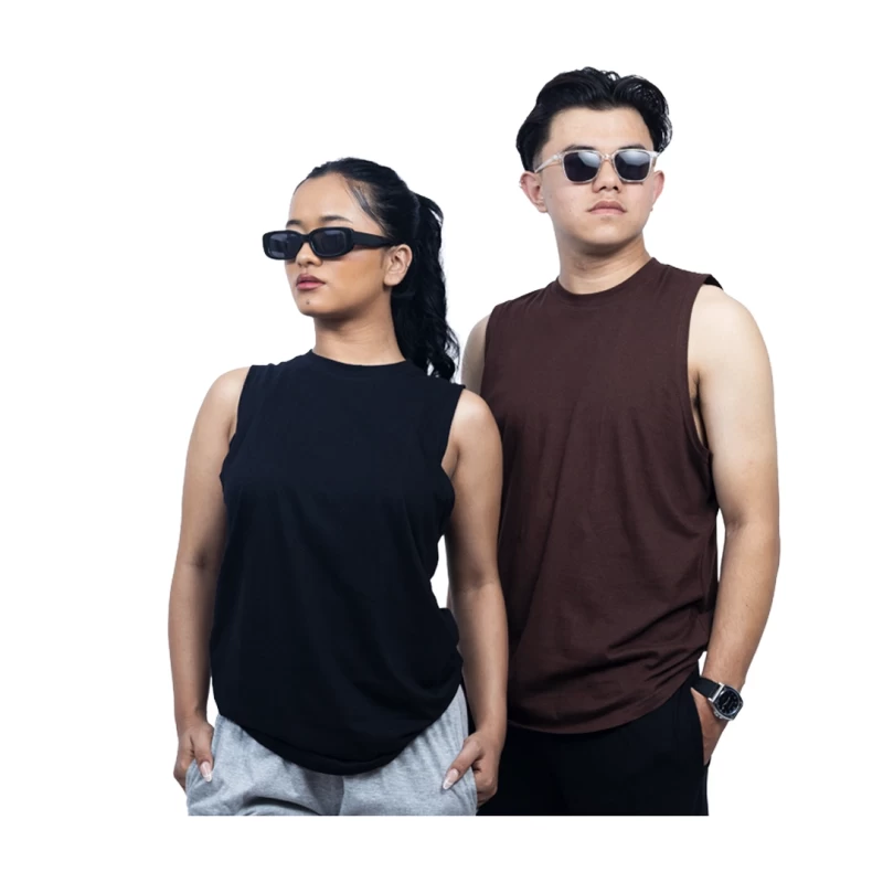 A female model in a black tank top and a male model in a brown tank top wearing the unisex KTM CTY Aerolite Tanktop, styled with sunglasses for a casual summer activewear look.