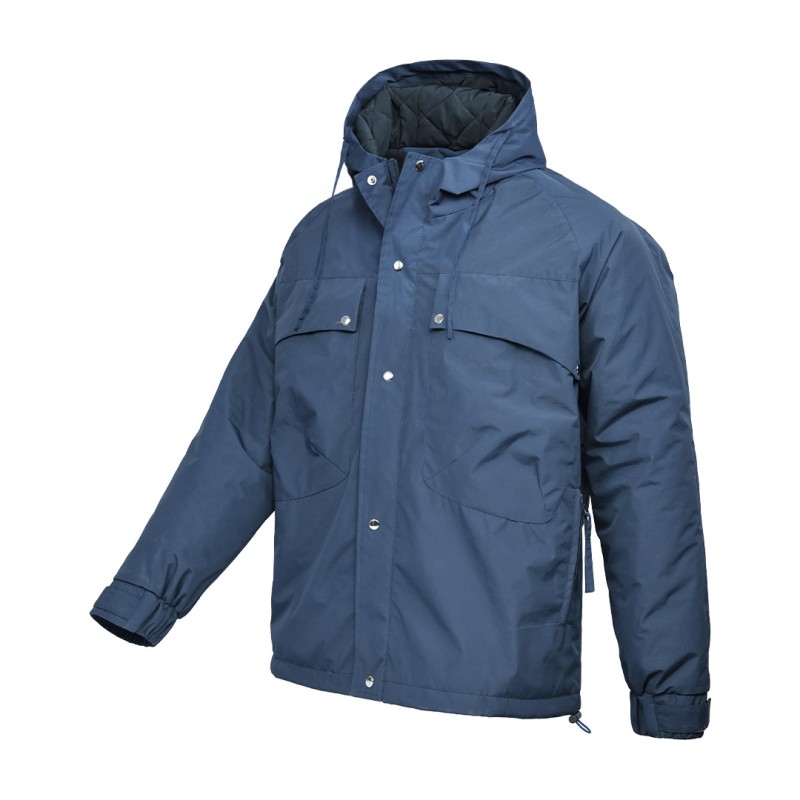 A male model wearing sunglasses and a heavy-duty, navy blue KTM CTY Cargo Shield Hoodie Winter Jacket, featuring a thick hood, snap-button front and multiple cargo pockets for cold weather protection. 0