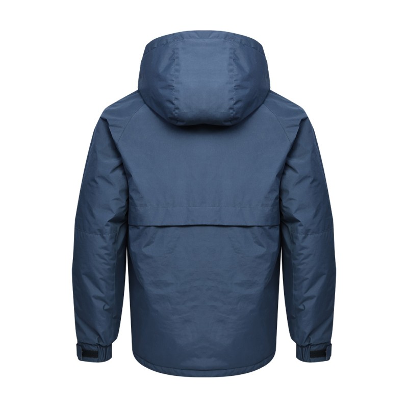 A male model wearing sunglasses and a heavy-duty, navy blue KTM CTY Cargo Shield Hoodie Winter Jacket, featuring a thick hood, snap-button front and multiple cargo pockets for cold weather protection. 1