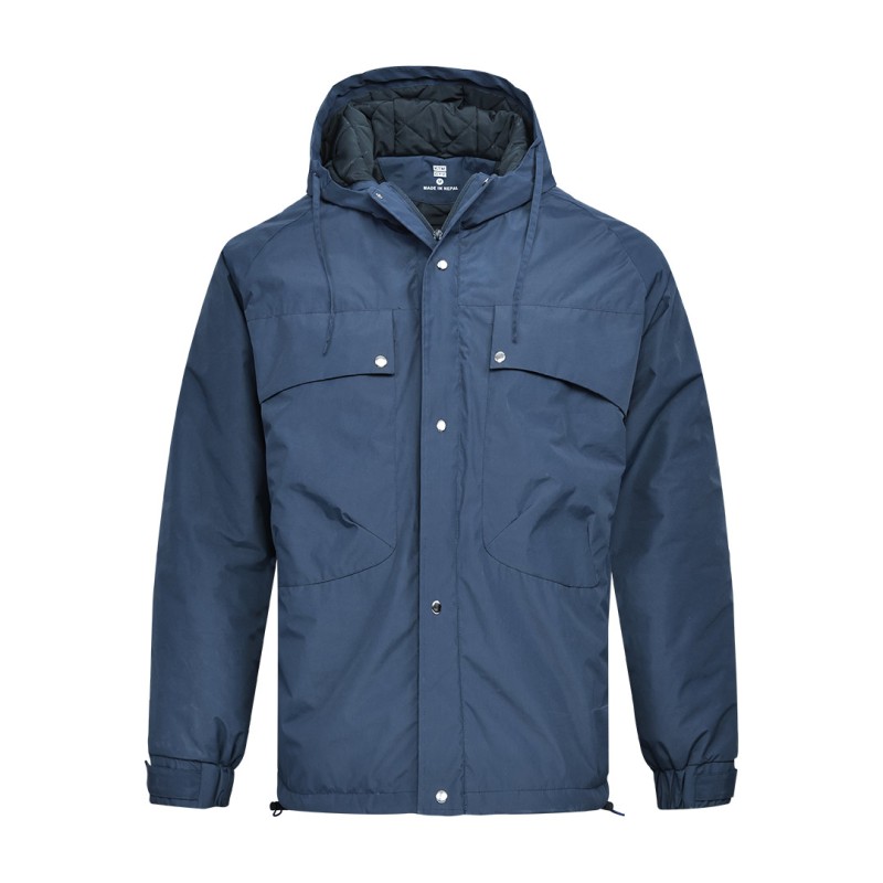 A male model wearing sunglasses and a heavy-duty, navy blue KTM CTY Cargo Shield Hoodie Winter Jacket, featuring a thick hood, snap-button front and multiple cargo pockets for cold weather protection. 0