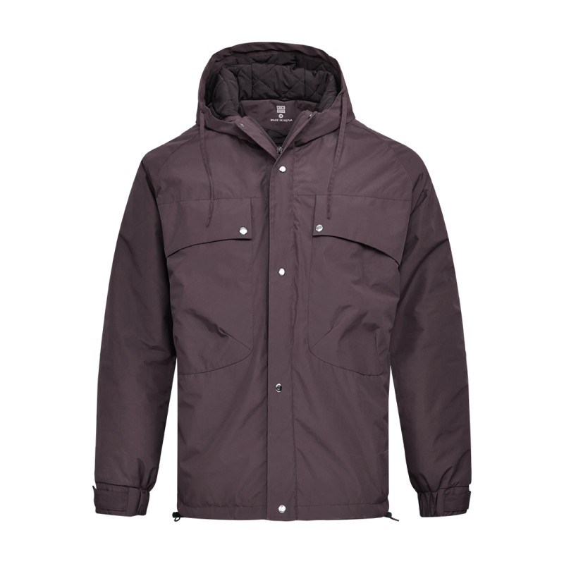 A male model wearing sunglasses and a heavy-duty, navy blue KTM CTY Cargo Shield Hoodie Winter Jacket, featuring a thick hood, snap-button front and multiple cargo pockets for cold weather protection. 2