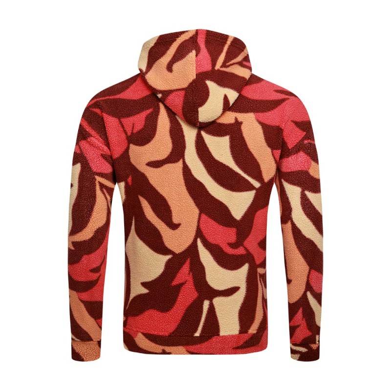 Model styling the KTM CTY Oversize Emberprint Sherpa Hoodie, featuring a warm, textured fleece with an earthy brown, green, and cream abstract pattern, oversized fit, with her hands in the front kangaroo pocket 3