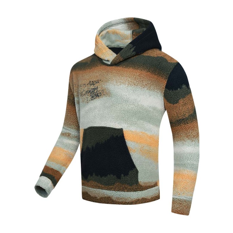 Model styling the KTM CTY Oversize Emberprint Sherpa Hoodie, featuring a warm, textured fleece with an earthy brown, green, and cream abstract pattern, oversized fit, with her hands in the front kangaroo pocket 4