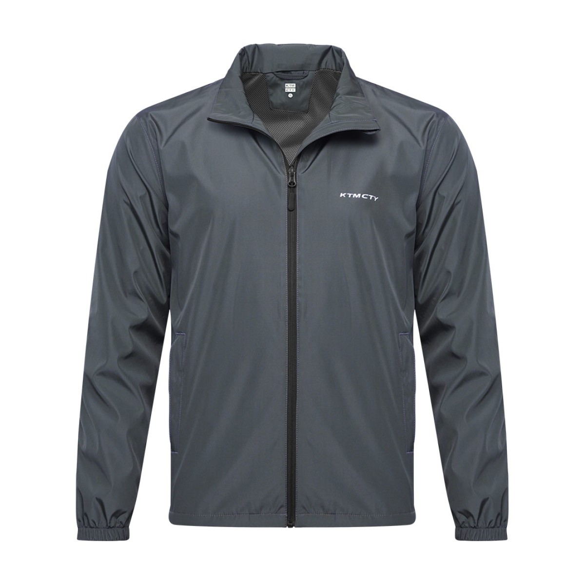 A male model wearing sunglasses looks off to the side while adjusting the collar of his olive green KTM CTY windbreaker, windcheater. The lightweight windguard jacket features a full-zip front, elastic cuffs, and a small white logo on the chest 1