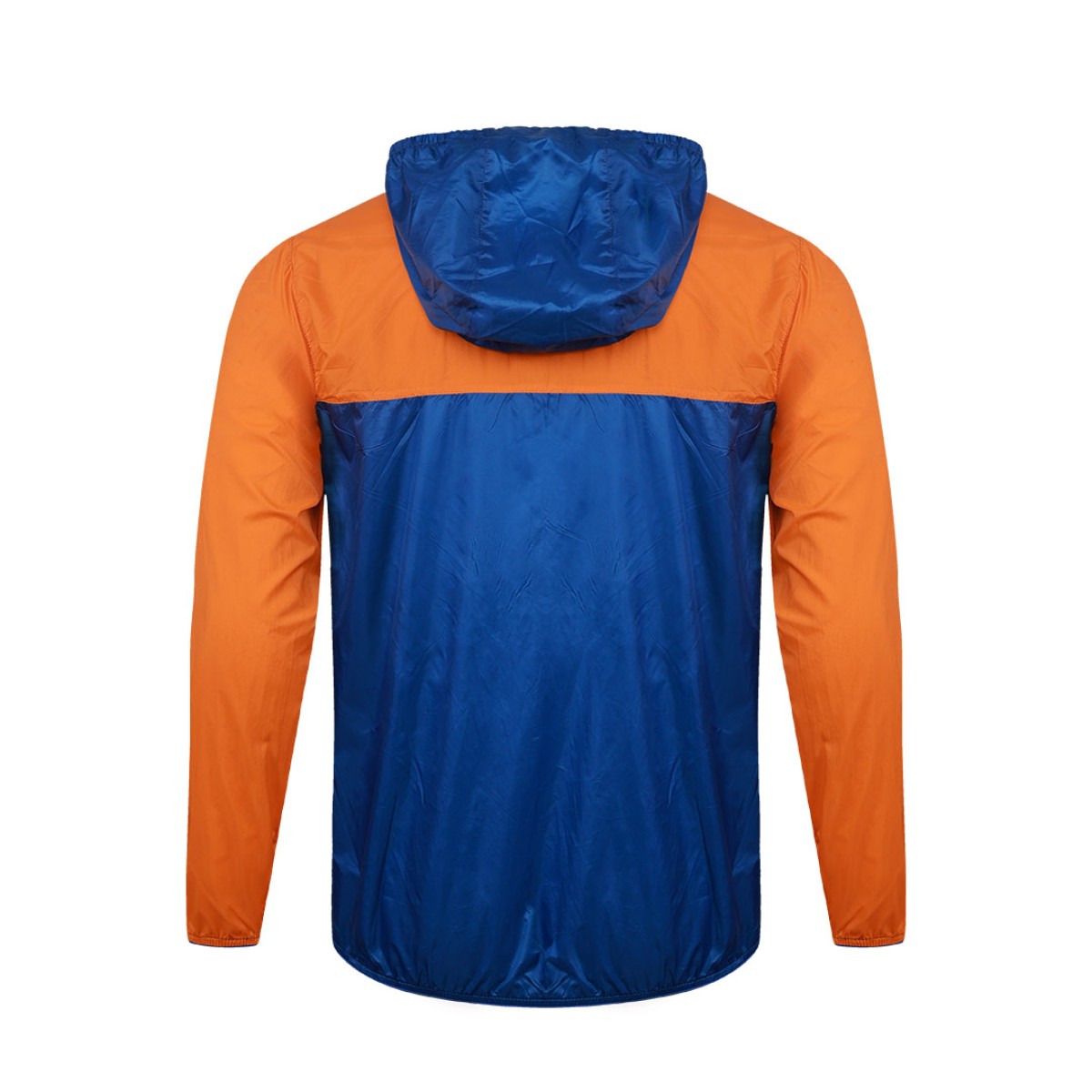 Front view of a male model styling a vibrant red and blue color-block lightweight windcheater jacket. This casual Unisex Windbreaker Jacket features a full zipper and a protective hood, making it a great outer layer for summer wear jacket. 1