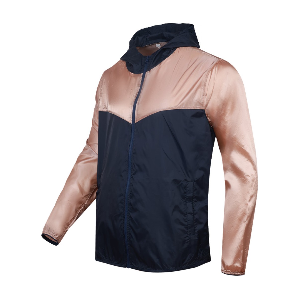 Front view of a male model styling a vibrant red and blue color-block lightweight windcheater jacket. This casual Unisex Windbreaker Jacket features a full zipper and a protective hood, making it a great outer layer for summer wear jacket. 8