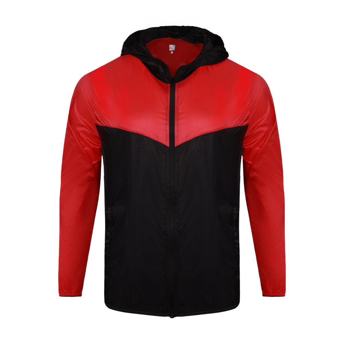 Front view of a male model styling a vibrant red and blue color-block lightweight windcheater jacket. This casual Unisex Windbreaker Jacket features a full zipper and a protective hood, making it a great outer layer for summer wear jacket. 4