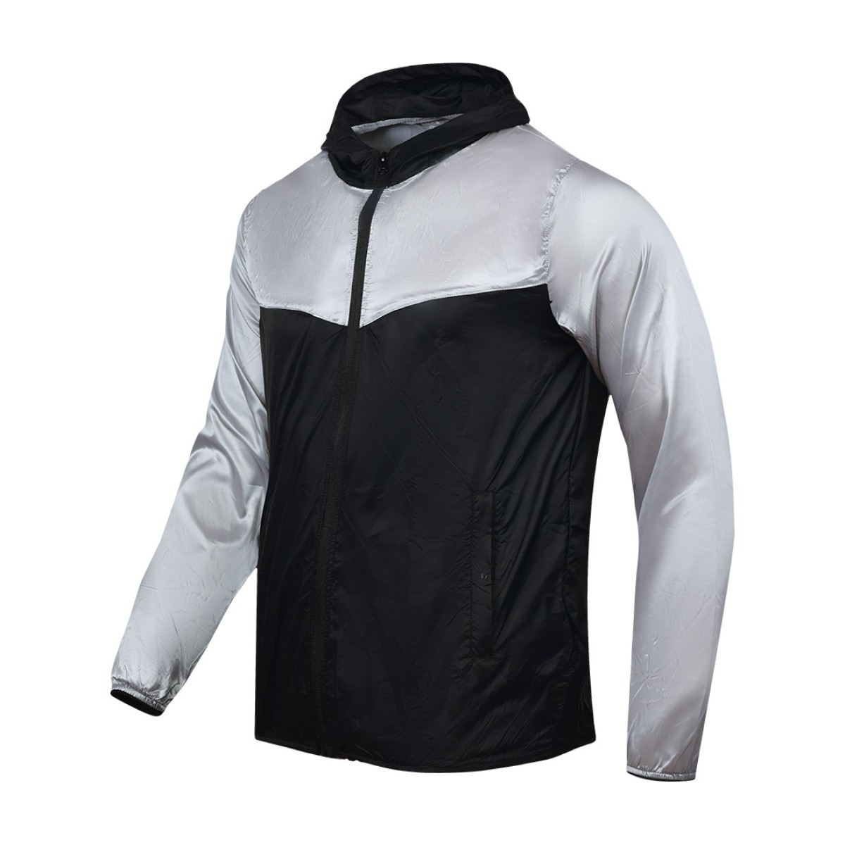 A smiling male model wearing the lightweight SkyShield Windcheater Jacket, featuring a bold red and bright blue color-block design, a full front zipper and an adjustable hood 2