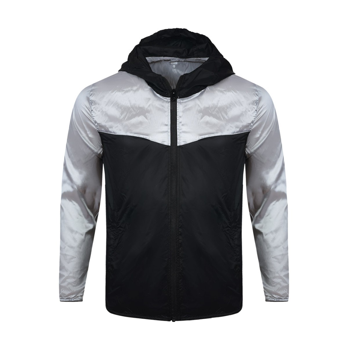 A smiling male model wearing the lightweight SkyShield Windcheater Jacket, featuring a bold red and bright blue color-block design, a full front zipper and an adjustable hood 3