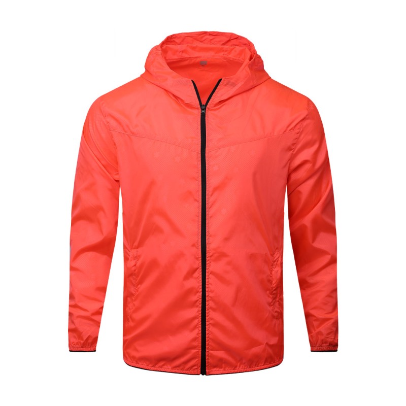 A male model adjusting the zipper of the lightweight, solid red Velocity Breeze Windcheater Jacket with hoodie, featuring a hood and a contrasting black front zipper 4